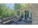 Cozy outdoor patio with comfortable seating, perfect for relaxation and entertaining amidst lush greenery at 3063 Wimbledon Ln, Rock Hill, SC 29732