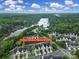 Aerial view of townhomes near a lake, showcasing community layout and proximity to the water at 314 Wave Crest Dr, Tega Cay, SC 29708