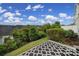 Serene backyard view with lush greenery and a partial view of a stylish outdoor rug at 314 Wave Crest Dr, Tega Cay, SC 29708
