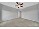 Neutral bedroom featuring carpet flooring, a ceiling fan, and neutral walls at 314 Wave Crest Dr, Tega Cay, SC 29708