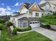 Stylish two-story home with stone accents, a two-car garage, and beautifully landscaped grounds at 314 Wave Crest Dr, Tega Cay, SC 29708