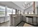Bright kitchen with stainless steel dishwasher, granite countertops, ample cabinet space, and natural light at 314 Wave Crest Dr, Tega Cay, SC 29708