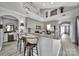 Kitchen bar area with granite countertops, barstool seating, and an open view to the rest of the house at 314 Wave Crest Dr, Tega Cay, SC 29708