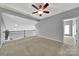 Spacious loft area with carpet, a ceiling fan, and a view of the floor below at 314 Wave Crest Dr, Tega Cay, SC 29708