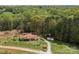 Aerial view of the house showing the home's placement on a wooded lot at 335 Ridgewood Dr, Mt Ulla, NC 28125