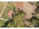 High aerial view of the property with wooded area and a house on a beautiful sunny day at 335 Ridgewood Dr, Mt Ulla, NC 28125