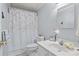 Bathroom with a decorative shower curtain, vanity, and a white toilet at 335 Ridgewood Dr, Mt Ulla, NC 28125
