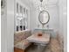Cozy breakfast nook with booth seating, pendant lighting, decorative mirror and view to adjacent room at 335 Ridgewood Dr, Mt Ulla, NC 28125