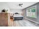 Cozy bedroom with a metal bed frame, gray walls, and a ceiling fan at 3612 Cobbleridge Dr, Charlotte, NC 28215