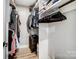 Walk-in closet with clothing racks and suitcase at 3612 Cobbleridge Dr, Charlotte, NC 28215