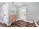Bright entryway with a coat rack and shoe storage, complemented by luxury vinyl plank flooring at 3612 Cobbleridge Dr, Charlotte, NC 28215