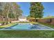Beautiful backyard with inground pool, spa and separate garage and a wood privacy fence at 3709 Commonwealth Ave, Charlotte, NC 28205