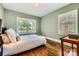Charming bedroom features two windows and beautiful hardwood floors at 3709 Commonwealth Ave, Charlotte, NC 28205