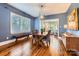 Elegant dining room with hardwood floors, stylish lighting, and ample seating at 3709 Commonwealth Ave, Charlotte, NC 28205