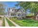Charming two-story home with a welcoming front porch and well-maintained landscaping at 3709 Commonwealth Ave, Charlotte, NC 28205