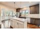Modern kitchen featuring stainless steel appliances, a center island, and hardwood floors at 3709 Commonwealth Ave, Charlotte, NC 28205