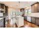 Modern kitchen with stainless steel appliances, granite countertops, and a center island at 3709 Commonwealth Ave, Charlotte, NC 28205