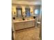 Bathroom featuring a double sink vanity with granite counters, modern fixtures, and tiled floors at 3713 Saint Regis Dr, Gastonia, NC 28056