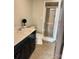 Bathroom with a vanity and a tiled shower at 3713 Saint Regis Dr, Gastonia, NC 28056