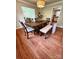 Dining room featuring hardwood floors, a modern chandelier, and a dining table with seating at 3713 Saint Regis Dr, Gastonia, NC 28056