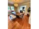 Dining room featuring hardwood floors, a modern chandelier, and a dining table with seating at 3713 Saint Regis Dr, Gastonia, NC 28056