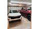 Spacious garage featuring a Kia Seltos and Ram truck parked inside at 3713 Saint Regis Dr, Gastonia, NC 28056