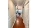 Hallway with hardwood floors and trim that provides seamless access to living areas at 3713 Saint Regis Dr, Gastonia, NC 28056