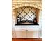 Unique brick alcove with cooktop, stylish backsplash, and countertop space at 3713 Saint Regis Dr, Gastonia, NC 28056