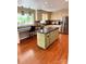Spacious kitchen with a center island, hardwood floors, and stainless steel appliances at 3713 Saint Regis Dr, Gastonia, NC 28056