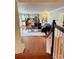 Open-concept living room and kitchen featuring hardwood floors and ample natural light at 3713 Saint Regis Dr, Gastonia, NC 28056