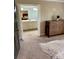 Main bedroom featuring a wood dresser and a view into the bathroom at 3713 Saint Regis Dr, Gastonia, NC 28056