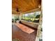 An elegant patio, features a patterned floor and scenic views of lush greenery and landscaping at 3713 Saint Regis Dr, Gastonia, NC 28056