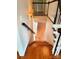 Staircase with hardwood steps and white risers at 3713 Saint Regis Dr, Gastonia, NC 28056