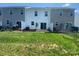 Green backyard with partial fence, patio, and lawn space, perfect for outdoor activities at 3776 Yorkshire Pl, Terrell, NC 28682
