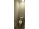 Compact bathroom featuring a standard toilet, a neutral color scheme, and tiled floors at 3776 Yorkshire Pl, Terrell, NC 28682