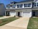 Charming townhome with white siding, black shutters, and a well-maintained front yard at 3776 Yorkshire Pl, Terrell, NC 28682