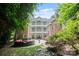 Multi-level back exterior with patios, balconies, and a seating area at 3819 Gleneagles Rd, Charlotte, NC 28210