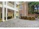 Multi-tiered brick backyard with outdoor seating and a stone bar for entertaining and relaxing at 3819 Gleneagles Rd, Charlotte, NC 28210