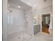 Modern bathroom showcasing a glass shower with tile accents, vanity with storage, and contemporary fixtures at 3819 Gleneagles Rd, Charlotte, NC 28210