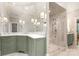This bathroom offers a designer vanity with marble countertops and glass enclosed shower with a bench seat at 3819 Gleneagles Rd, Charlotte, NC 28210