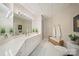 Bright bathroom featuring a spacious vanity, large mirror, and patterned tile flooring at 3819 Gleneagles Rd, Charlotte, NC 28210