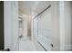 Clean bathroom boasts a tiled shower over the tub, plus decorative white walls and fixtures at 3819 Gleneagles Rd, Charlotte, NC 28210