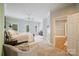 Bright bedroom with cozy armchair seating, and ample natural light, creating a relaxing atmosphere at 3819 Gleneagles Rd, Charlotte, NC 28210