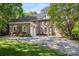 Stately brick home featuring a circular driveway and mature trees in a desirable neighborhood at 3819 Gleneagles Rd, Charlotte, NC 28210