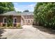 Traditional brick home featuring a well-manicured front yard and ample parking at 3819 Gleneagles Rd, Charlotte, NC 28210
