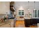 Bright kitchen with stone accents, stainless steel appliances, and a convenient island at 3819 Gleneagles Rd, Charlotte, NC 28210