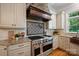 Well-equipped kitchen featuring stainless steel appliances, stone accents, and ample counter space at 3819 Gleneagles Rd, Charlotte, NC 28210