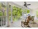 Relaxing porch featuring white columns, white railings, and rocking chairs at 3819 Gleneagles Rd, Charlotte, NC 28210