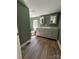 Bathroom with a gray double sink vanity, white counter, and green walls at 427 W Whitley St, Norwood, NC 28128