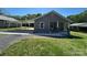 Quaint single-story home featuring a covered parking area and a well-manicured lawn at 427 W Whitley St, Norwood, NC 28128